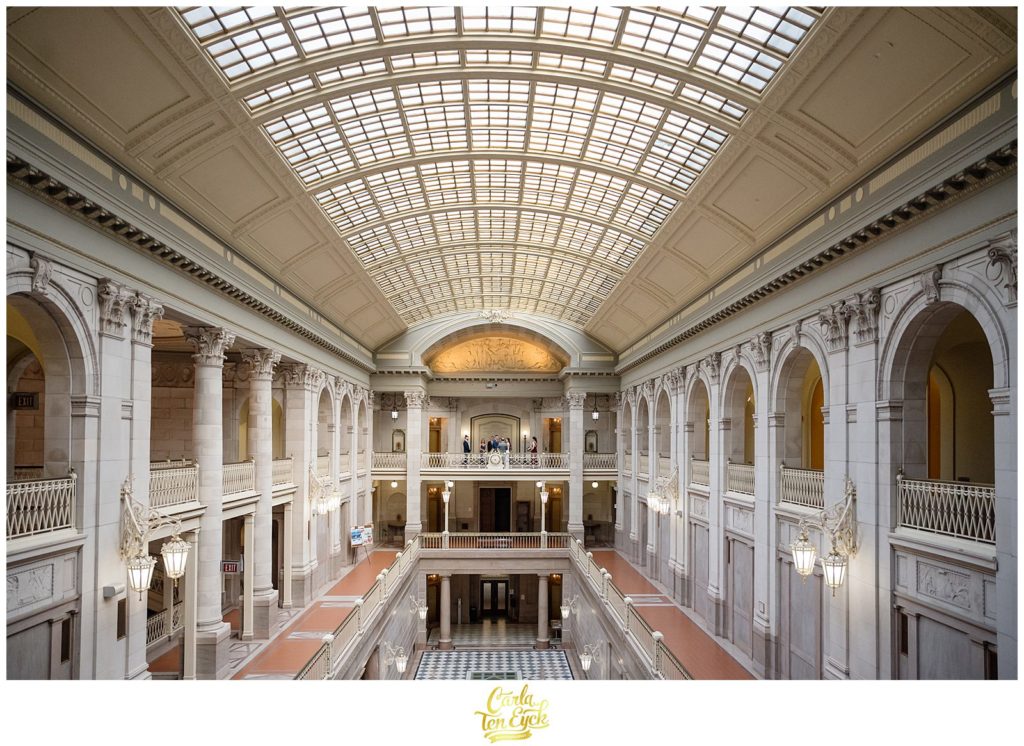 A wedding ceremony takes place in the grand atrium of Hartford City Hall in Hartford CT